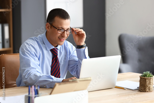 Male accountant working wit...