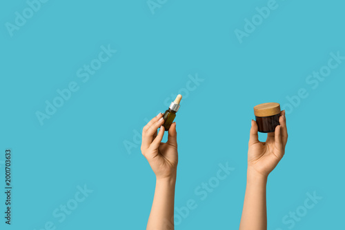 Female hands with bottle an...