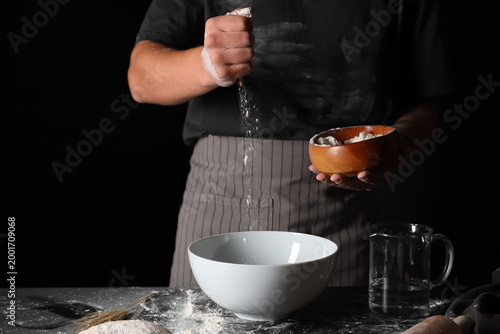 Man preparing fresh dough o...