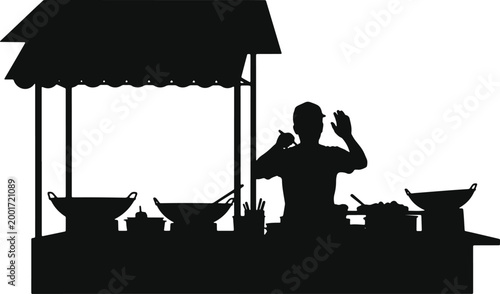 Silhouette of a food stall vendor preparing food behind a counter with woks and serving dishes transparent background.