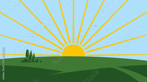 Sunrise over rolling hills with trees and sun rays in morning landscape