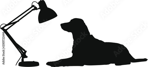 Dog lying down near adjustable desk lamp, silhouette, study or focus concept, pet companion at home or office.