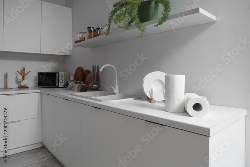 Rolls of paper towels on counter in kitchen interior