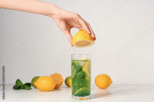 Female hand with glass of l...