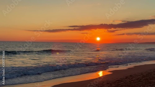 Golden sunset over ocean horizon showing calm natural seascape and open sky