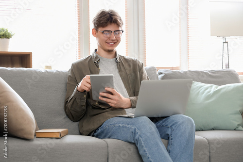 Male student with tablet co...