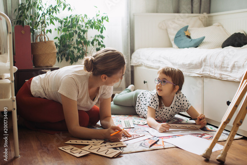 Mother and child learning together at home