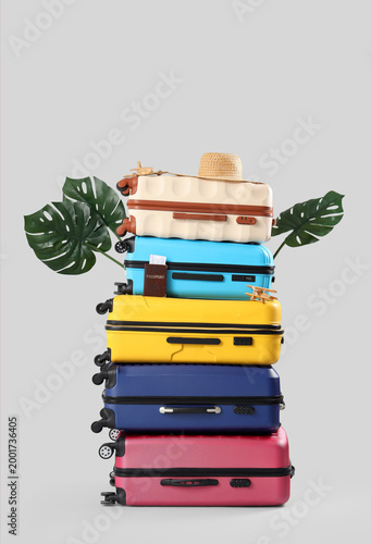 Stack of suitcases with hat...