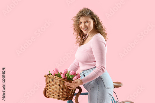 Happy young woman with bouq...