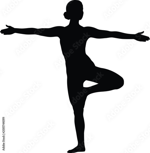 Silhouette of a person performing the tree pose yoga asana