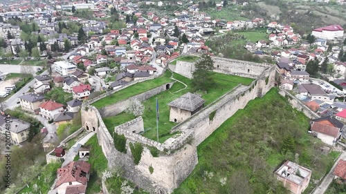High-angle 4K drone shot of the historic Jajce Fortress and the old town citadel