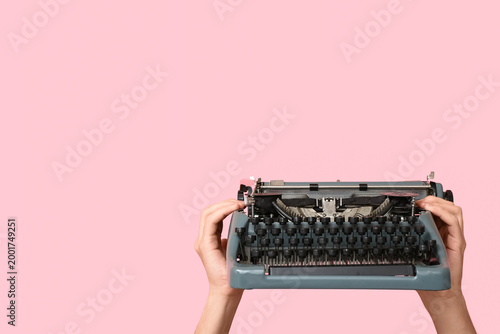 Hands holding vintage typew...