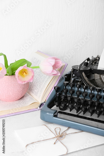 Vintage typewriter with pap...
