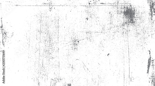 Grungy distressed texture with scattered dots and scratches on a white background grunge
