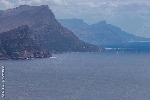 A View on False Bay and the coastal line on the other side of the bay seen from Cape Point. False Bay is part of the Atlantic Ocean between the mountainous Cape Peninsula and the Hottentots Holland Mo