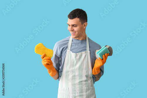 Young man with many sponges...