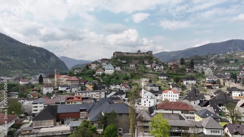 High-angle 4K drone shot of the historic Jajce Fortress and the old town citadel