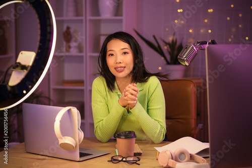 Young Asian woman recording...