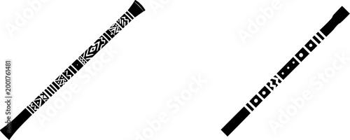 A hollow ceramic didgeridoo with intricate black patterns on a white background rests against a stark white backdrop