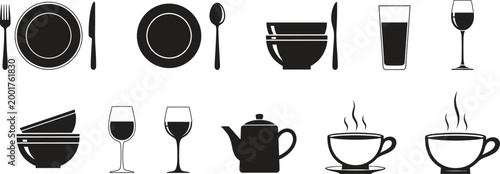 Black and white flat lay of various dining tableware and cutlery