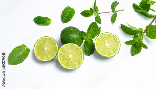 Fresh Whole and Sliced Limes with Mint Leaves