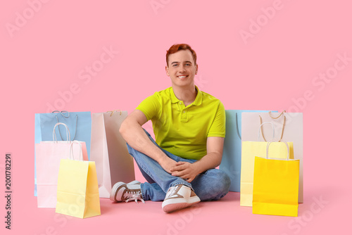 Young man with shopping bag...