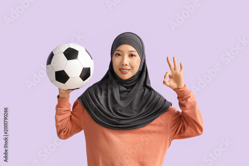 Young sporty Asian woman in...