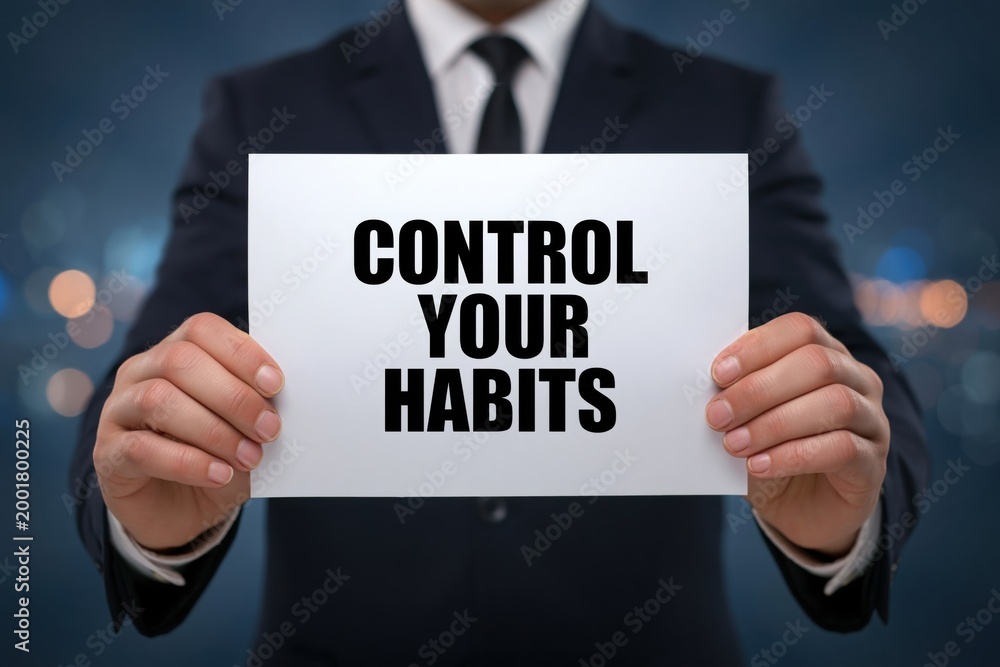 Obraz premium Businessman advises to Control Your Habits for personal and professional growth
