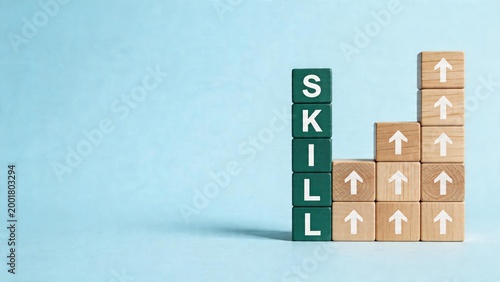Business skill growth concept wooden blocks spelling skill word in green color stacked blocks with arrows pointing up forming chart shape on blue background representing