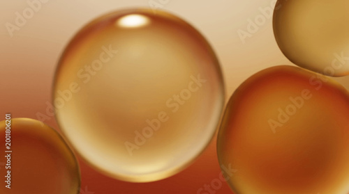 A close-up view of several shiny liquid droplets falling slowly in warm lighting conditions.