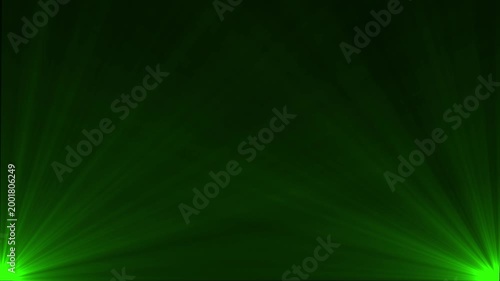 Green stage spotlight beams with atmospheric haze and volumetric lighting effects
