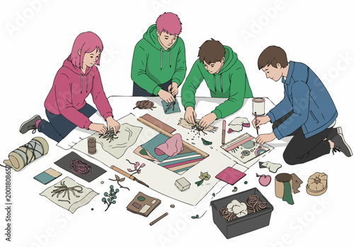 Four young people collaborating on a creative textile and mixed media art project spread across a large workspace.