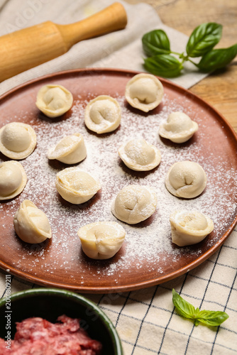 Plate with uncooked dumplin...
