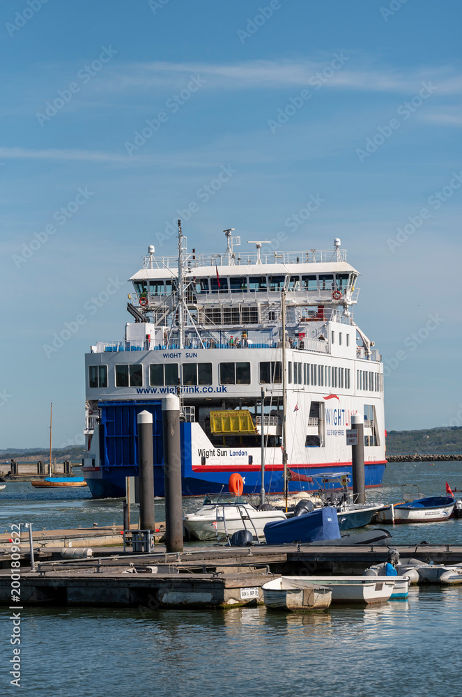 Fototapeta premium Lymington Hampshire England UK. 25.04.2026. Isle of Wight ferry White Sun negotiating the Lymington River with vehicles and passengers aboard inbound to the Lymington terminal.