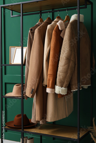Coat rack with hats and fra...