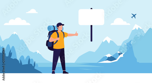 Determined hiker with a large blue backpack stands on a road and hitches a ride with a blank white sign in the mountains.