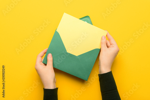 Female hands with envelope ...