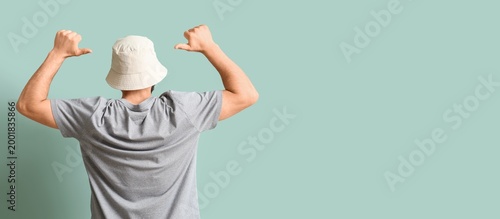 Young man in stylish bucket...