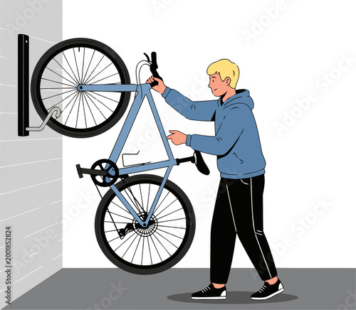 A man installs a bicycle storage rack on a wall, showcasing efficient space saving. Clean, modern design. Ideal for home or apartment storage.