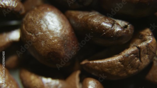 Macro Shot of Roasted Coffee Beans on Dark Surface.