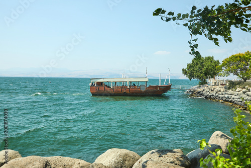 Fotografi View of the Sea of Galilee with a pleasure boat from the east side on a summer s