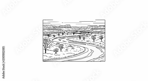 Winding river carving through a barren, arid canyon landscape with sparse vegetation