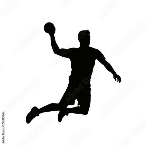 Silhouette of a handball player in mid-air throwing the ball.