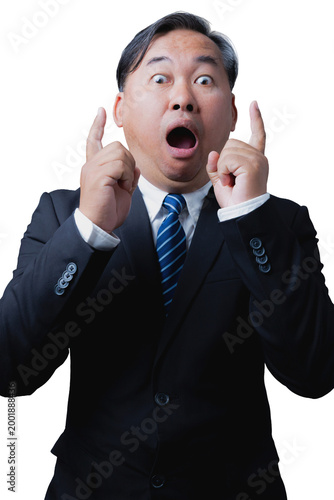 A mature Asian businessman is captured with high energy, a shocked facial expression, and wide open mouth.