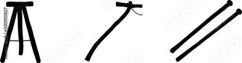 An exquisite antique wooden peg leg stool, exuding a vintage charm with its darkened wood and rustic aesthetic, stands gracefully against a pristine white backdrop