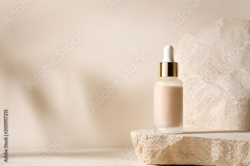 Minimalist skincare serum bottle on natural stone platform