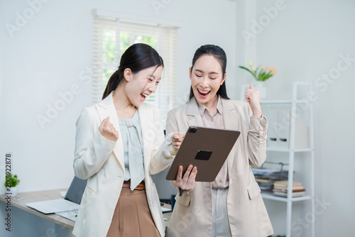 Asian woman succeeds at office