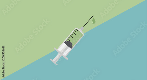 syringe with green liquid drop on colorful background