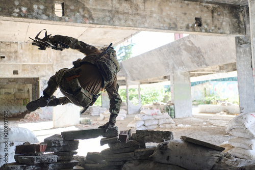 Canvastavla Soldier Leaping Over Rubble Inside Abandoned Building During Urban Military Trai