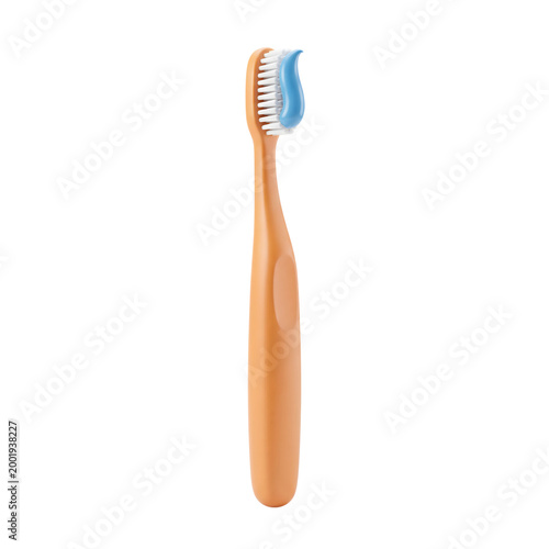 Vertical front view of orange toothbrush with blue toothpaste dollop isolated on transparent grid background